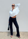 Jeans Low rise Black denim Belt looped waist Zip & button fastening Classic five-pocket design Bootcut leg  Raw edge hem