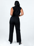 Black matching set Vest top Classic collar Plunging neckline Buttons fastening at front Twin faux front pockets Straight-leg pants High waisted Belt looped waist Pleated front