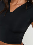 bLACK Top Cropped fit, short sleeves, v cut detail in neckline
