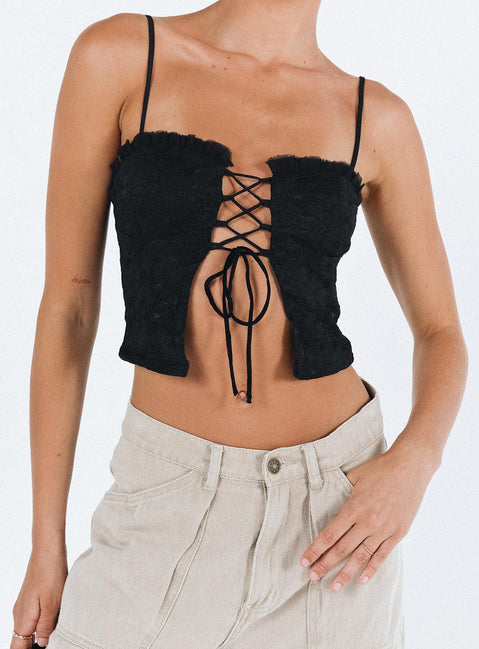 Crop top Lace material  Ruffle neckline  Adjustable shoulder straps  Inner silicone strip at bust  Lace up fastening at front Non stretch Fully lined 