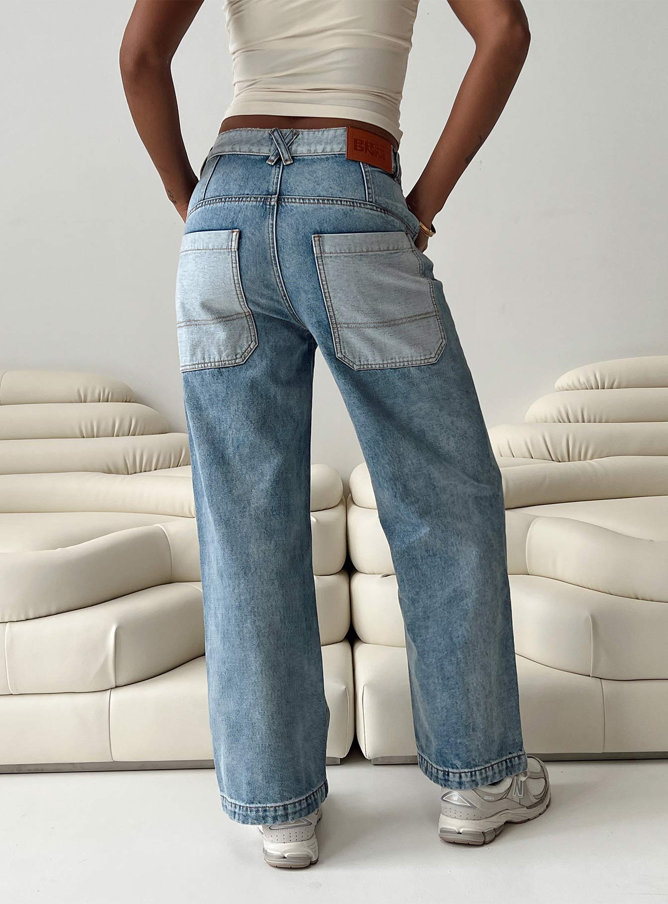 Jeans Mid wash denim High rise Belt looped waist Zip and button fastening Four classic pockets Branded patch at back Straight leg