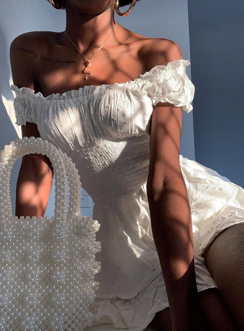 Playsuit Can be worn on or off the shoulder Soft textured material Shirred waistband Ruffle detailing Elasticated neck and sleeves Fully lined