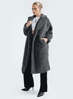 Coat Collared neckline Front button fastening Twin side pockets