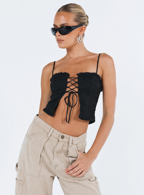 Crop top Lace material  Ruffle neckline  Adjustable shoulder straps  Inner silicone strip at bust  Lace up fastening at front Non stretch Fully lined 