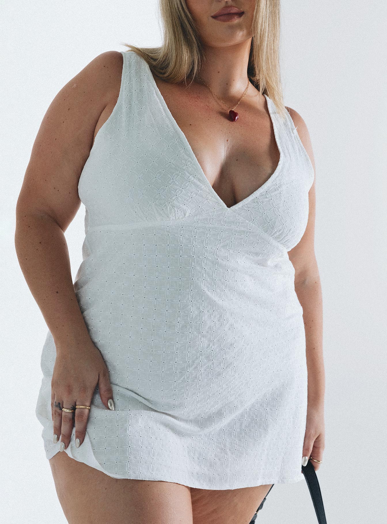 White mini dress Broderie anglaise material V neck Singe waist tie at back Invisible zip fastening at side  Wide shoulder straps A line fit