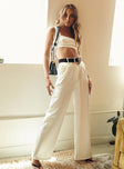 Matching set Crop top Fixed straps Invisible zip fasting at side High waisted pants Wide relaxed leg Belt loops at waist Zip & button fastening Stuble pleats at waist Twin hip pockets